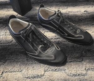 Tod's Black Leather Loafers with White Stitching